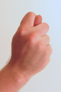 Gesture_fist_with_thumb_through_fingers
